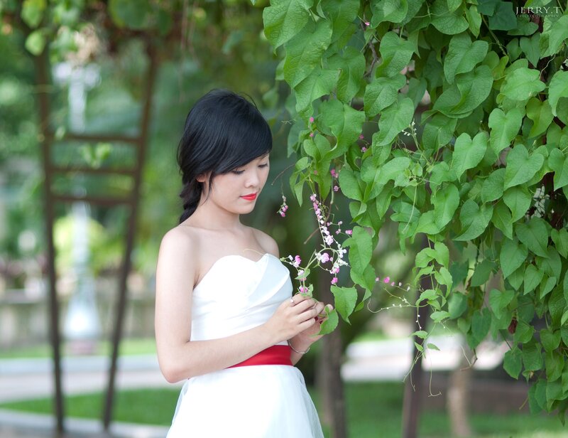 woman in white dress with flowers