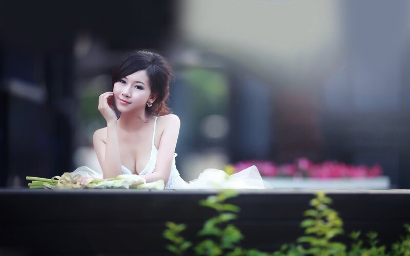 woman in white dress with flowers