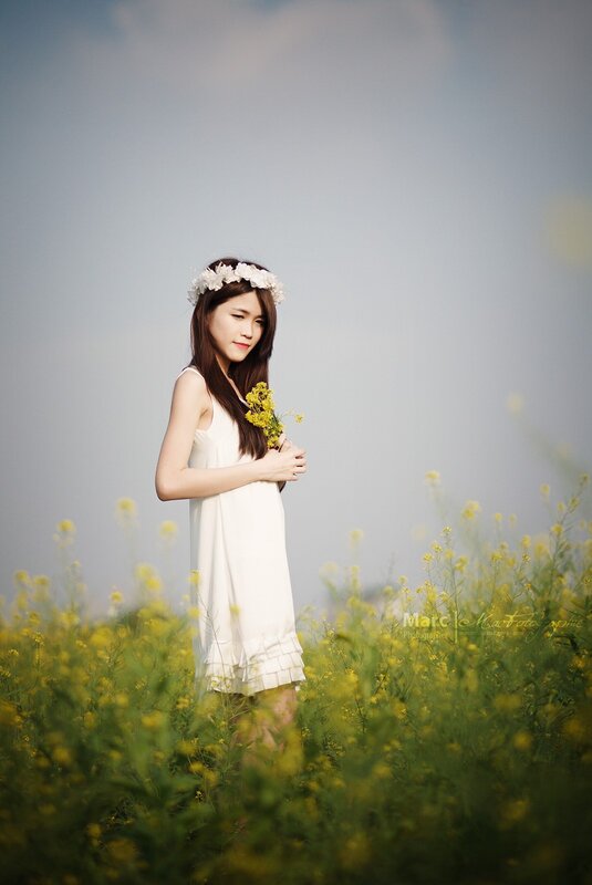 woman in white dress with flowers