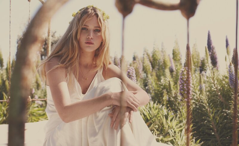 woman in white dress with flowers