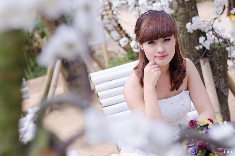 woman in white dress with flowers