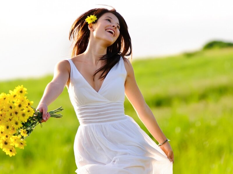 Woman in white dress with flowers