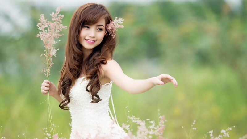 woman in white dress with flowers