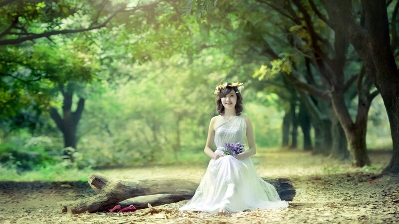 Woman in white dress with flowers
