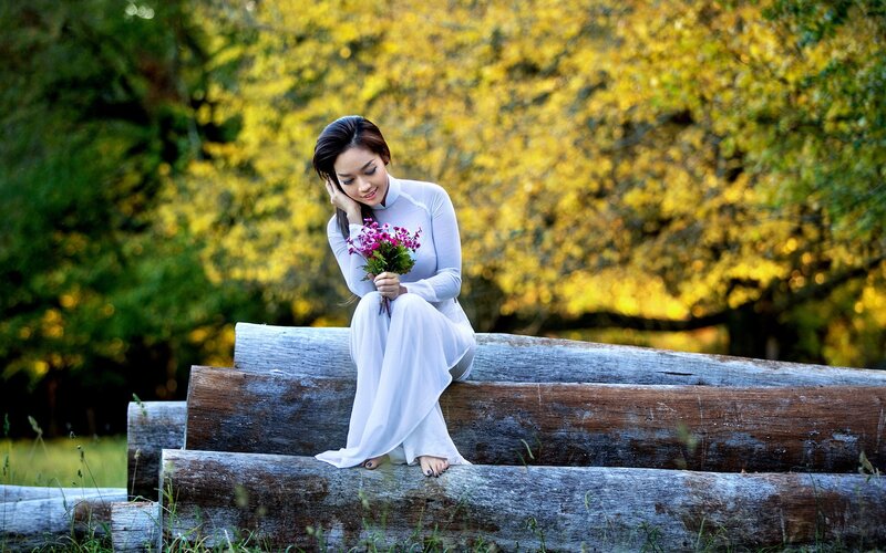 Woman in white dress with flowers