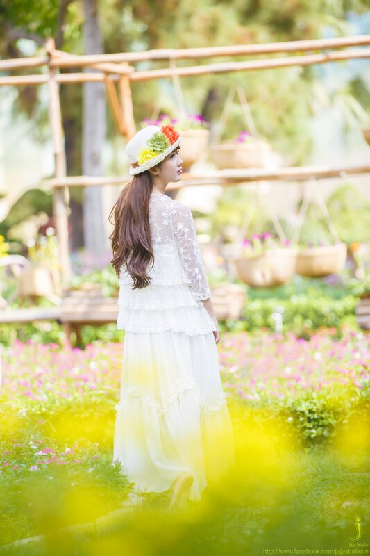 Woman in white dress with flowers