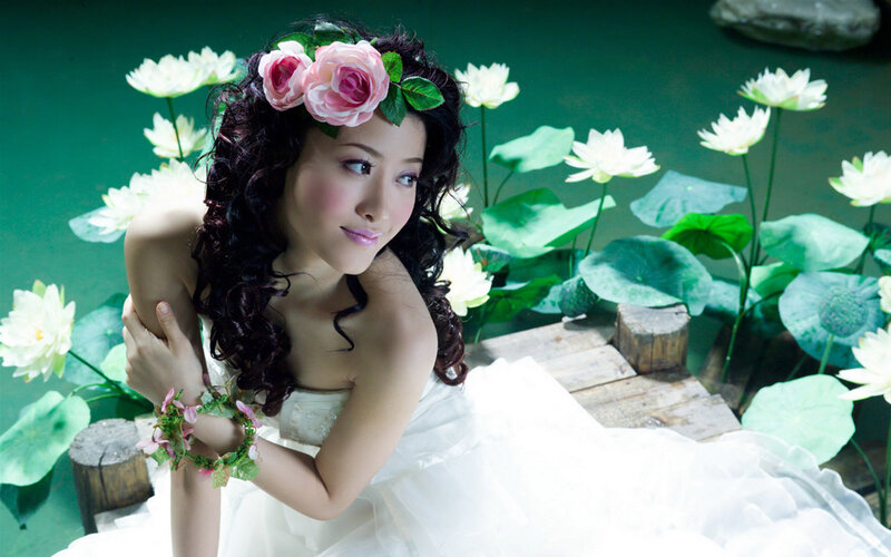woman in white dress with flowers