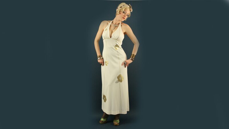 woman in white dress with gold accents