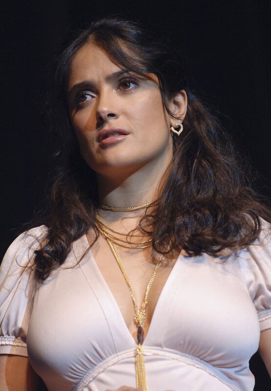 woman in white dress with gold jewelry