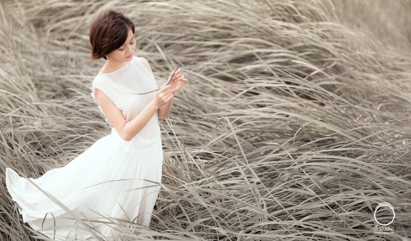 woman in white dress with grass