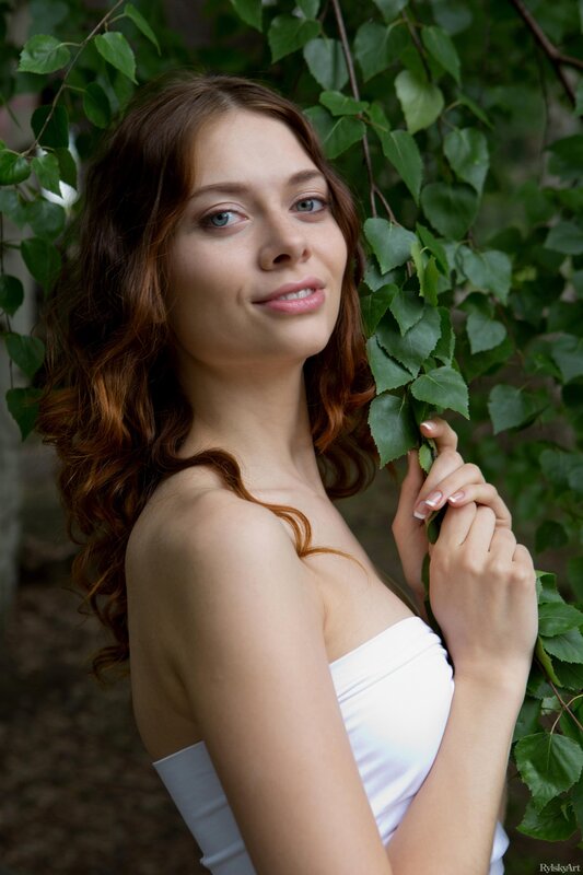 woman in white dress with green leaves
