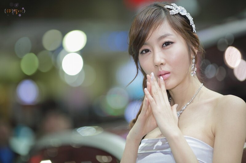 woman in white dress with jewelry