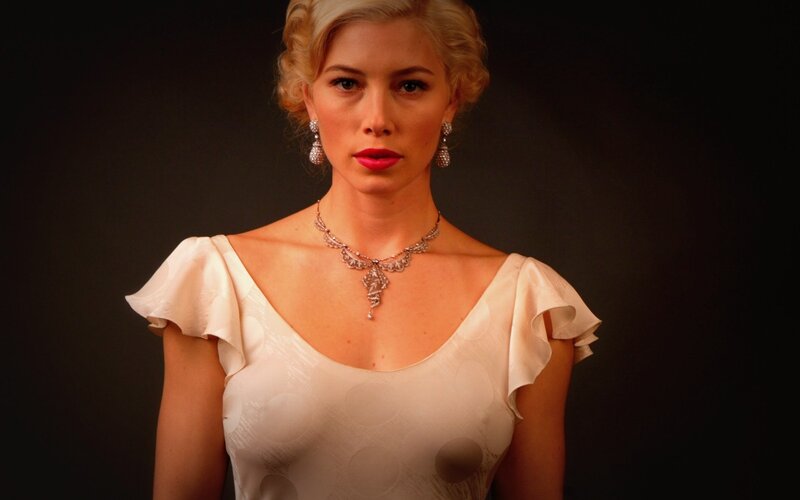 woman in white dress with jewelry