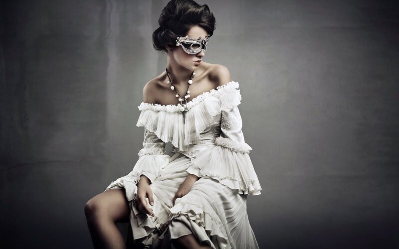 woman in white dress with mask