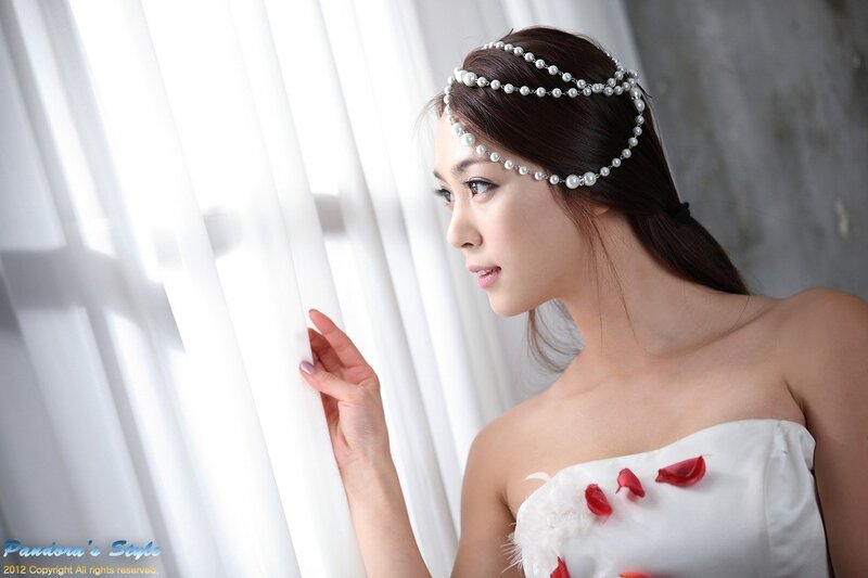 woman in white dress with pearls