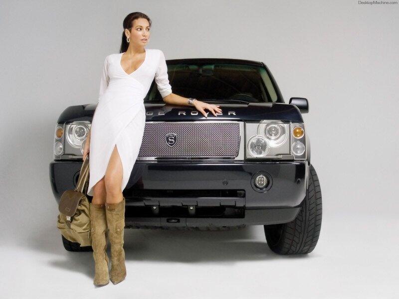 Woman in white dress with Range Rover
