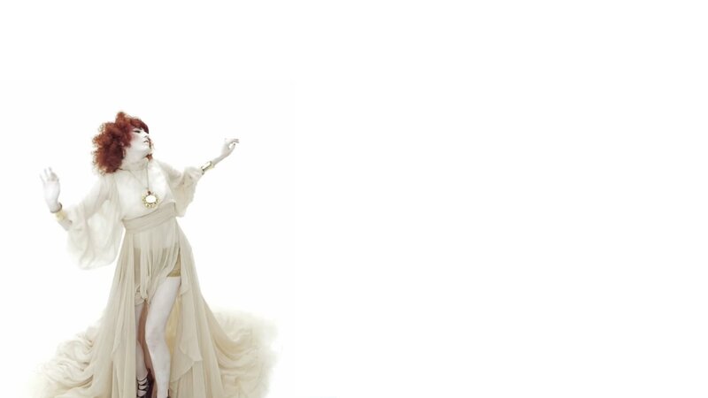 woman in white dress with red hair