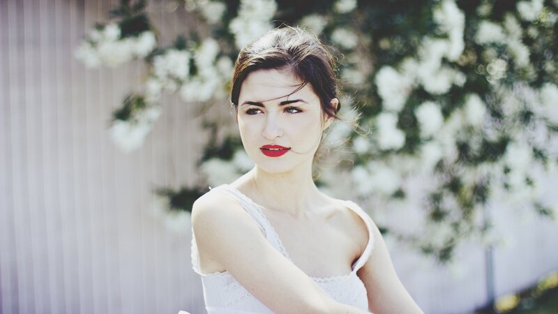 woman in white dress with red lipstick