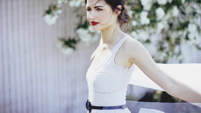 woman in white dress with red lipstick