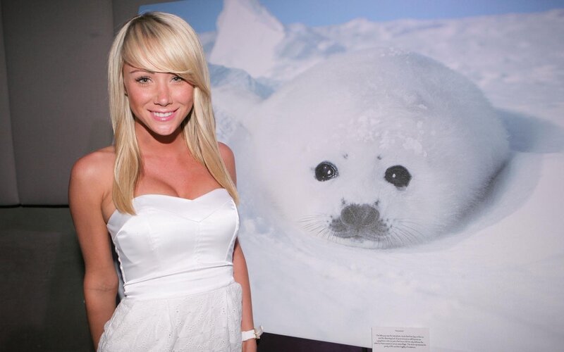 Woman in white dress with seal photo