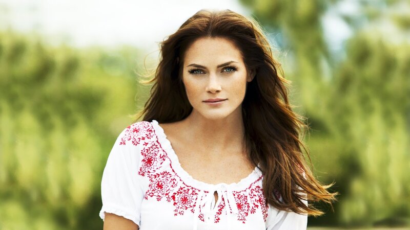 woman in white embroidered top