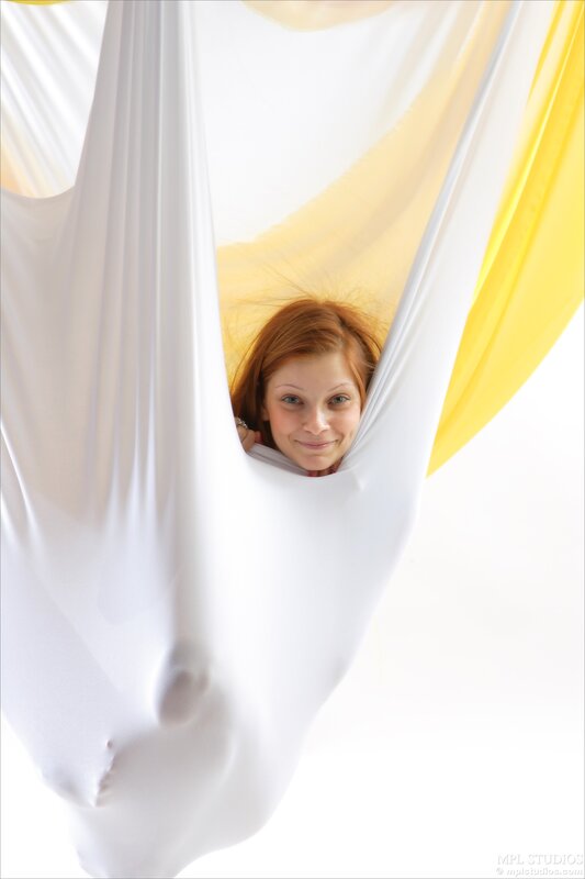 woman in white fabric hammock