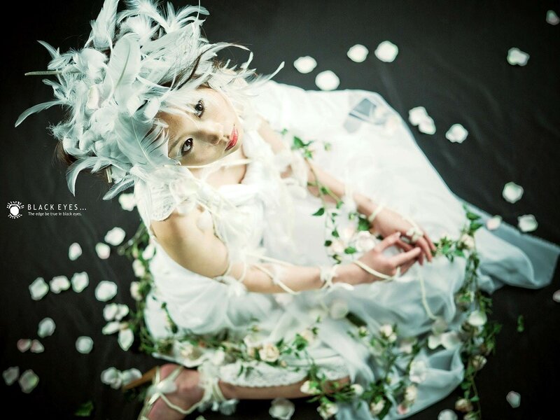 woman in white feather costume