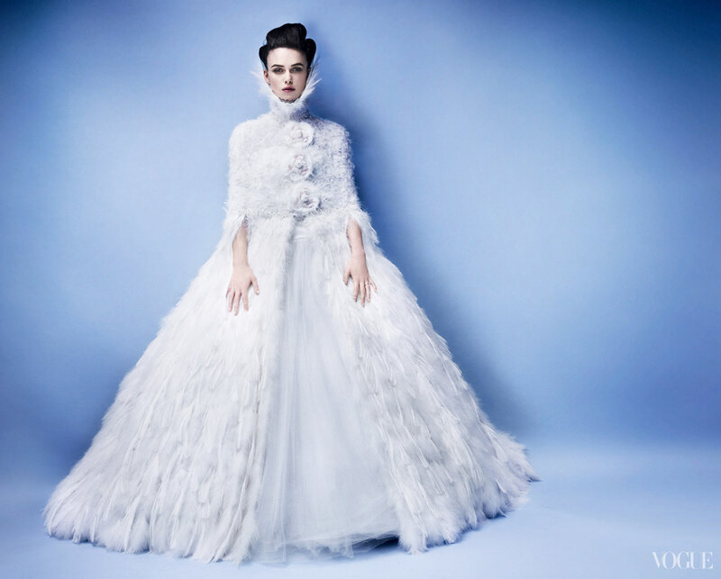 Woman in White Feather Gown — Dramatic