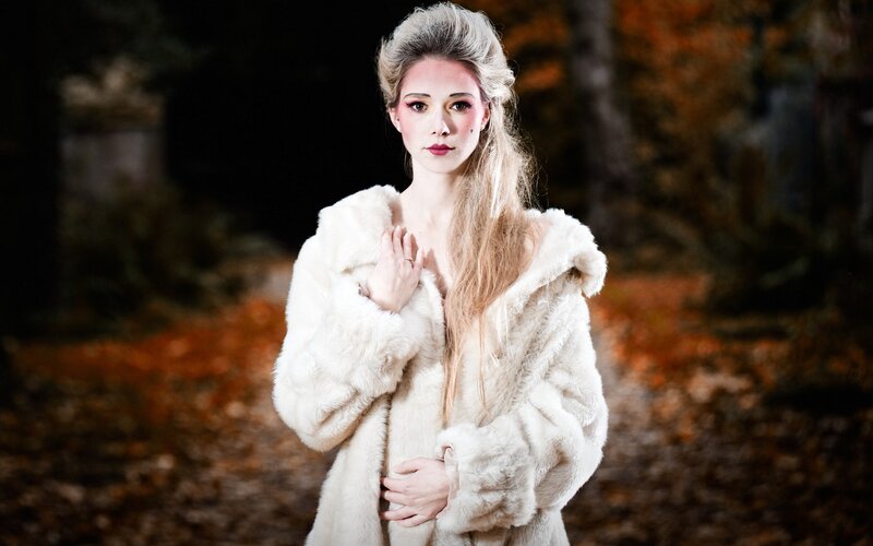 woman in white fur coat