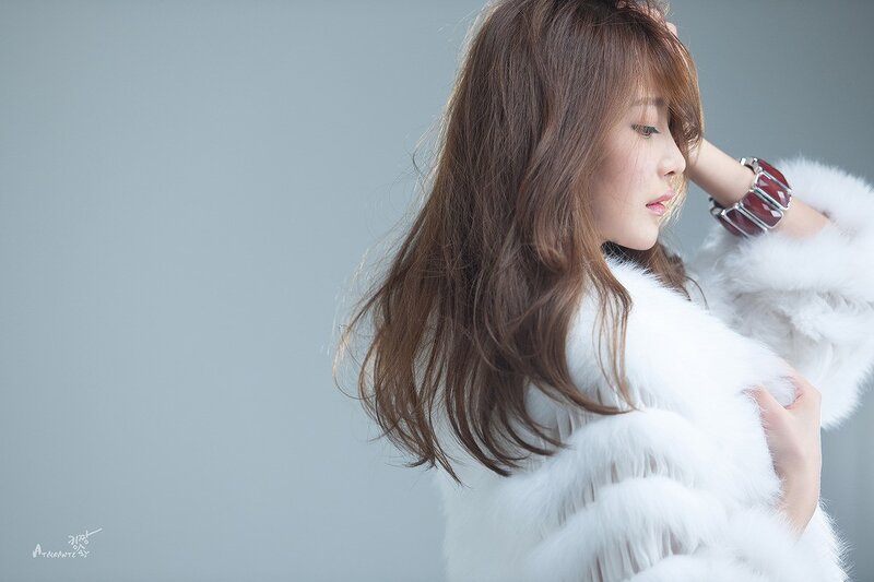 woman in white fur coat