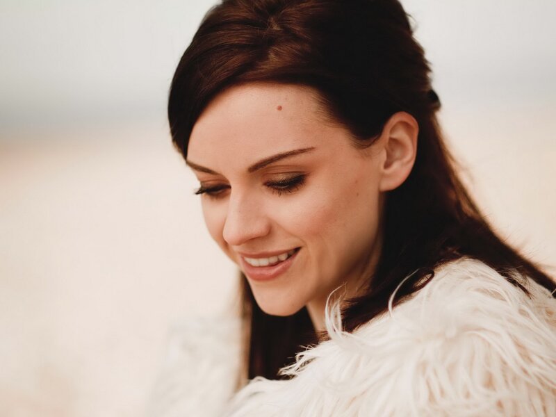 woman in white fur coat