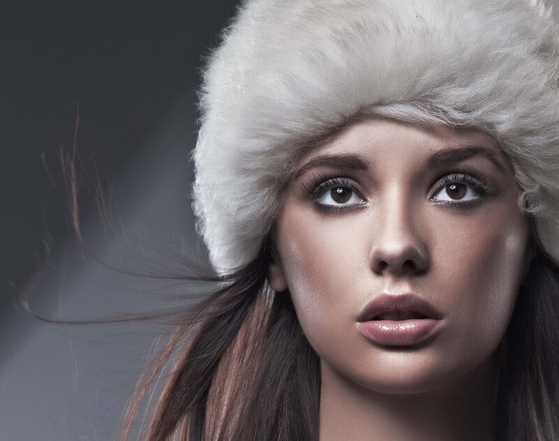 woman in white fur hat