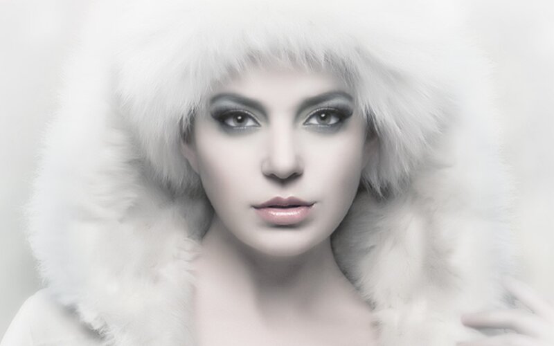 woman in white fur hood