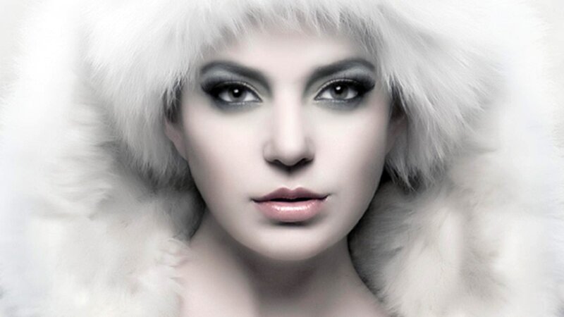 woman in white fur hood