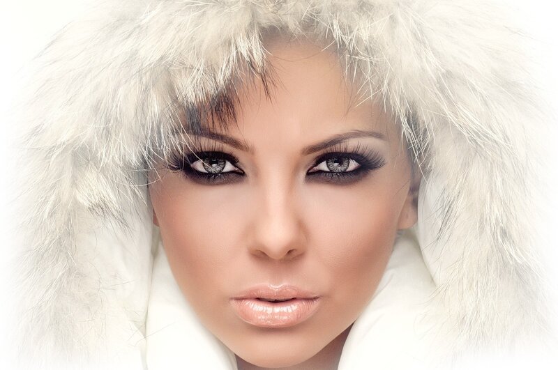 woman in white fur hood