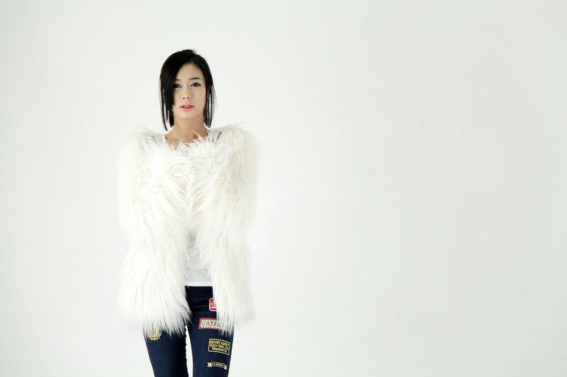 woman in white fur vest