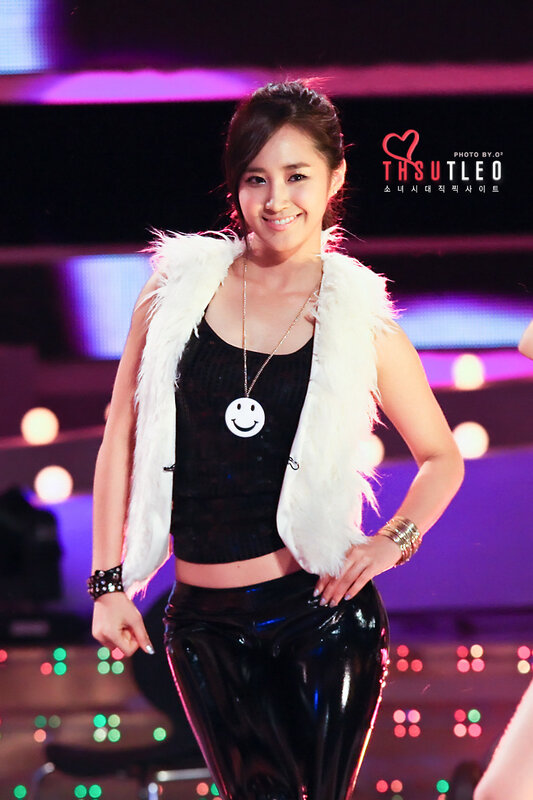 woman in white fur vest