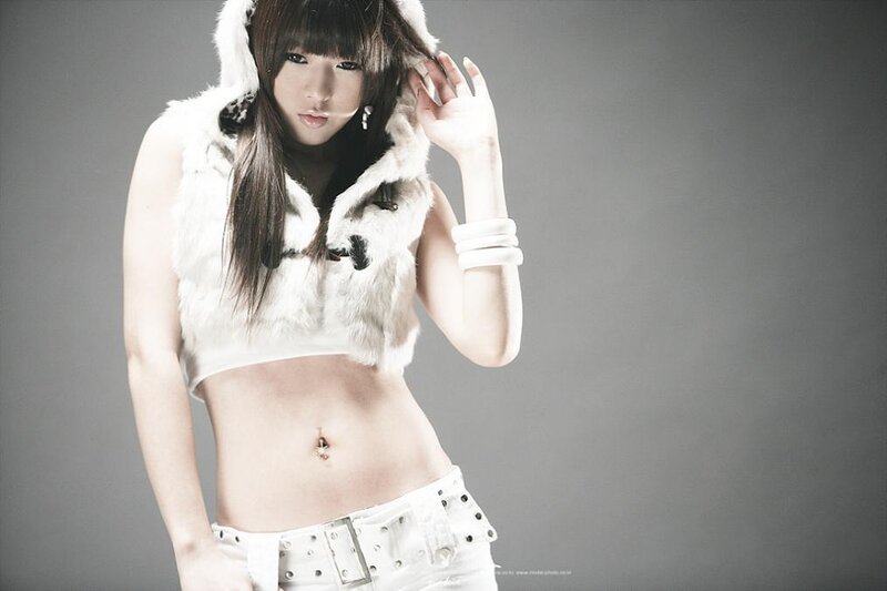 woman in white fur vest