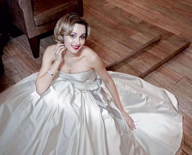 Woman in white gown on floor