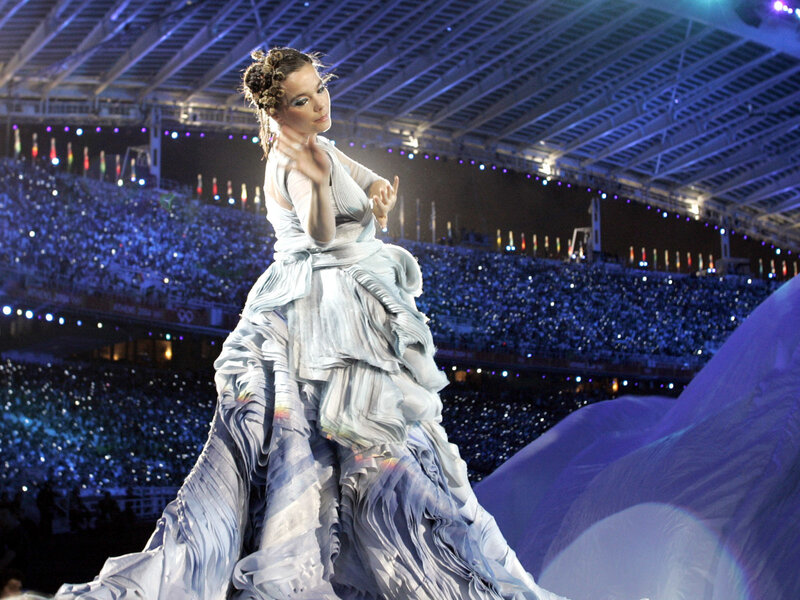 Woman in white gown on stage