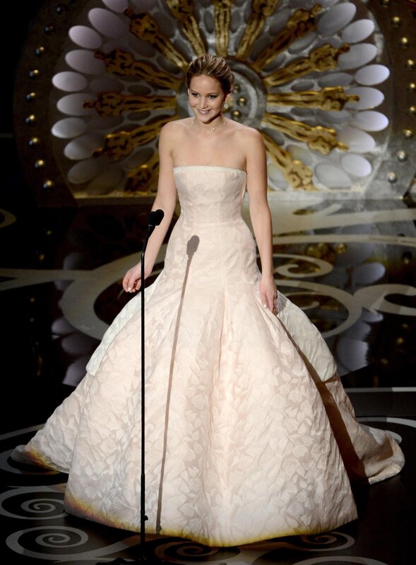 woman in white gown on stage