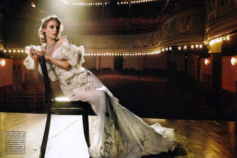 Woman in white gown on stage