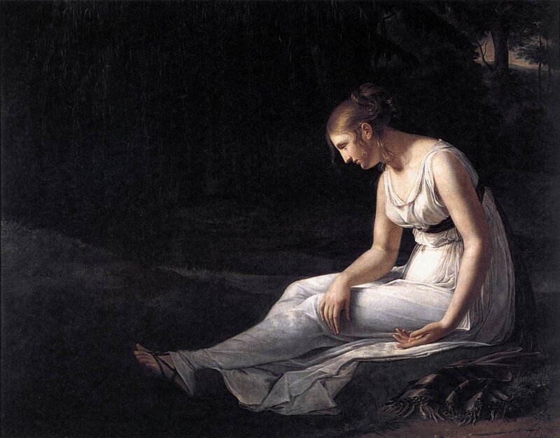 Woman in white gown sitting