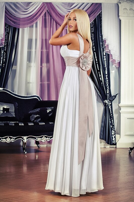 woman in white gown with bow