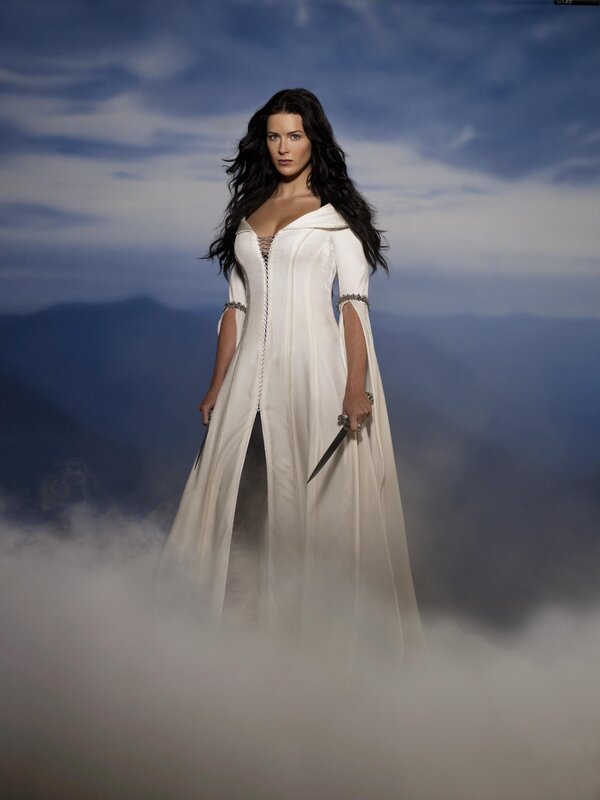 woman in white gown with dagger