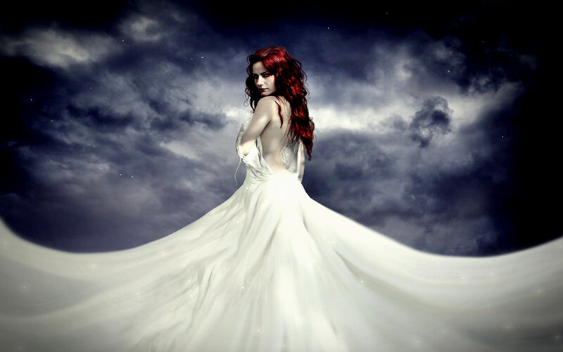 woman in white gown with red hair