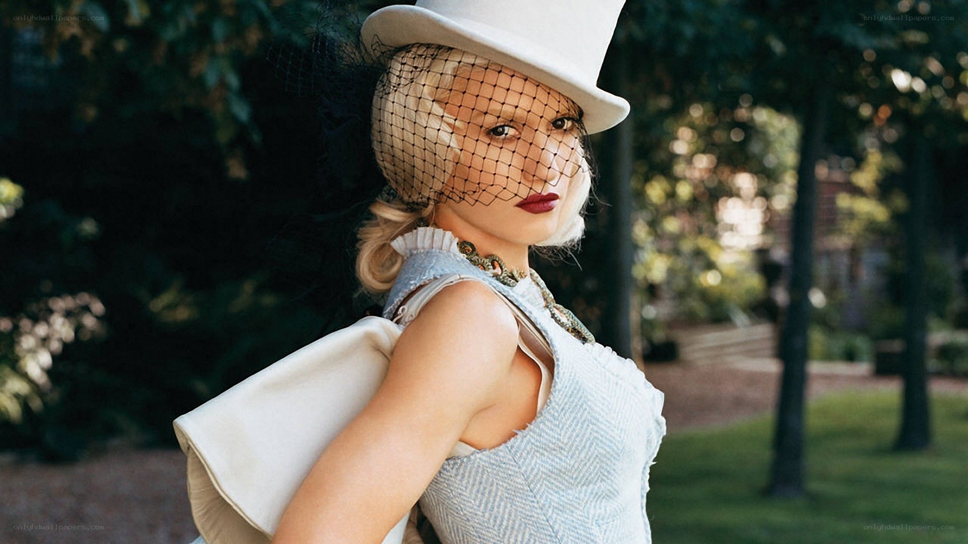 woman in white hat and veil