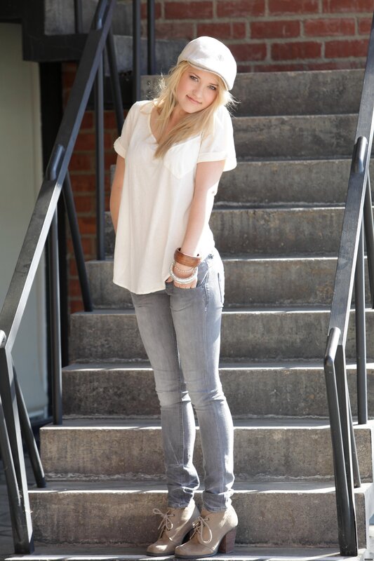 woman in white hat on stairs