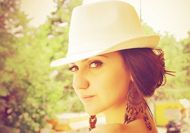 woman in white hat outdoors