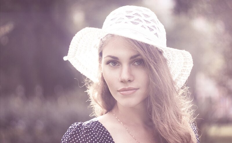 woman in white hat outdoors